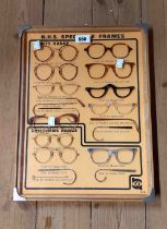 A vintage optician display case of NHS spectacle frames including adults and children's ranges