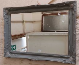 A powder blue painted framed bevelled oblong wall mirror