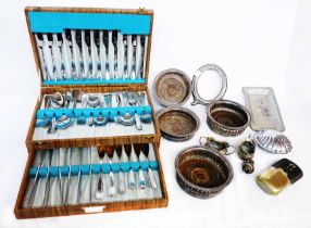 A canteen containing a six place setting of stainless steel cutlery - sold with four silver plated