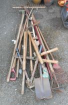 A quantity of garden tools including shears, rakes, etc.