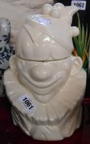 A vintage McCoy Pottery USA cookie jar of clown form - chips to rim