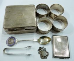 Four silver napkin rings (personalised), a match book sleeve, a damaged cigarette box, etc.