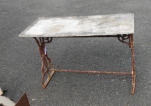 A 1.12m cast iron garden table base with associated white marble top