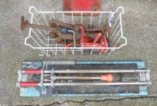 A Toledo TTC400 tile cutter - sold with a wire basket containing a quantity of hand drills, etc.
