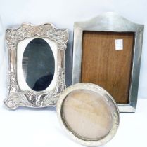 An Art Nouveau style silver fronted photograph frame with embossed butterfly and floral decoration