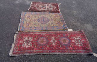 Three small vintage handmade wool rugs of varying age and design - the red ground runner - 1.6m X