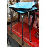 A pair of vintage tubular metal framed stools with blue Formica seats