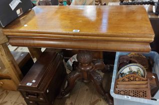 A 90cm Victorian mahogany fold-over tea table, set on carved bulbous pillar and quadruple scroll