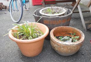 Three large garden plant pots - sold with a coopered half-barrel planter