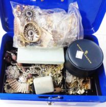 A blue metal cash box containing a quantity of assorted vintage and later costume jewellery and