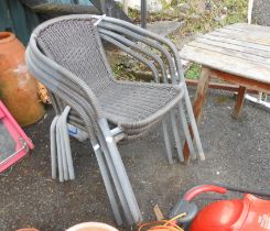 A set of four modern stacking garden chairs