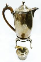 A George III silver hot water jug with flip-top and wooden scroll handle (cracked) by John Edwards