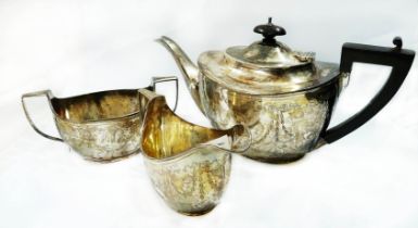 A silver three piece tea set of oval form with engraved harebell swag decoration - Birmingham 1913