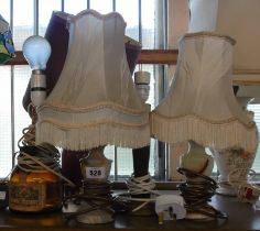 A quantity of five table lamps consisting of two onyx examples, a red Irish Crannos pottery lamp,
