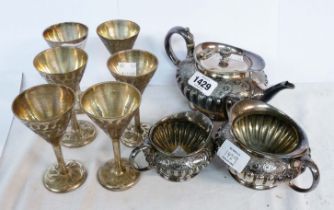 A silver plated three piece tea set of semi reeded design - sold with a set of six silver plated