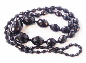 A dark faceted graduated bead necklace