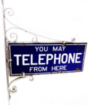 An original G.P.O. Telephone enamel sign and wall mounting bracket, with white lettering on blue
