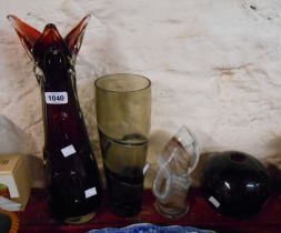 Four pieces of vintage art glass comprising a large ruby glass vase with clear cased knobbly