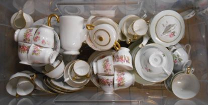 A crate containing a large quantity of bone china teaware including cups and saucers, teapots,