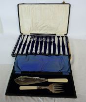 A cased set of six each stainless steel fish knives and forks - sold with a cased pair of fish
