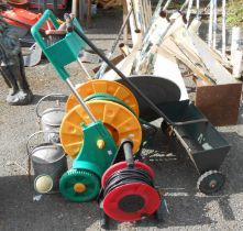 A quantity of assorted tools including hose reel, watering cans, etc.