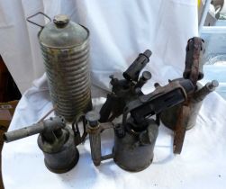 A box containing four old brass blow lamps and a copper hot water bottle