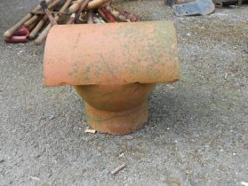 An old terracotta roof cowl