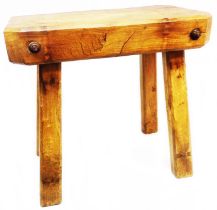 A 76cm old rustic elm butcher's block table with simple chamfered square legs attached with iron
