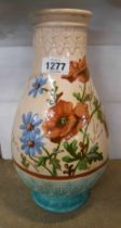 A large 19th Century Watcombe pottery vase with boldly painted flowers on a cream ground with