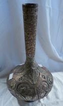 A Persian copper bottle vase of globe form with silver overlay decoration