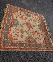 A vintage Turkish handmade wool rug retailed by Maple & Co. Oriental Carpets and bearing original