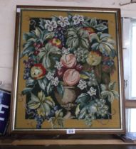 A vintage fire screen with internal floral embroidery decoration