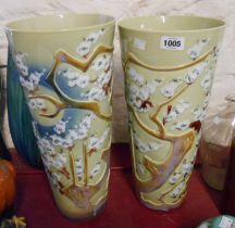 A pair of large 20th Century Chinese porcelain vases with moulded and hand painted enamel prunus