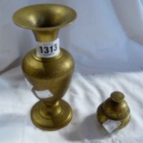 A brass vase and bell with all round etched decoration