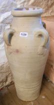 A large painted terracotta vase with four lug handles