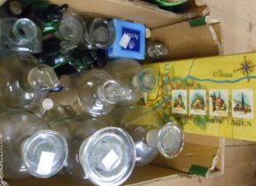 A box containing a selection of old chemist jars, poison bottles, etc.