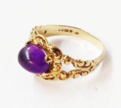 A 375 (9ct.) gold ornate antique style ring, set with amethyst cabochon - size K 1/2