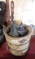 An antique wooden butter churn