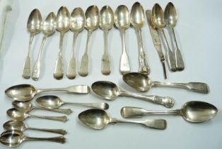 A bag containing assorted antique London silver teaspoons, also coffee spoons and a silver knife