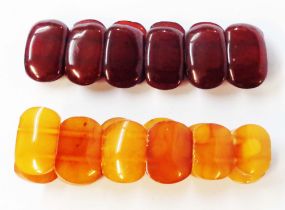 Two modern elasticated amber panel-link bracelets