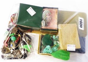 A bag containing vintage costume jewellery, coin bracelet, enamelled buckle, an ornate mesh