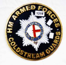 A modern 'HM Armed Forces Coldstream Guards' painted cast iron sign