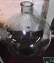 A large vintage glass carboy