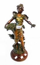 A 19th Century French spelter figure, depicting a woman with a basket of flowers with bronze
