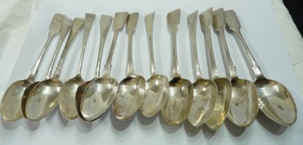 A bag containing assorted antique English silver tablespoons including fiddle pattern examples -