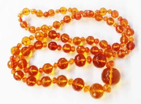 A vintage orange amber graduated bead necklace