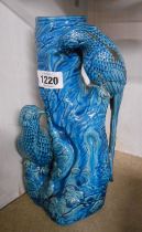 A Chinese pottery vase, depicting two birds on a tree stump with blue glaze finish - a/f