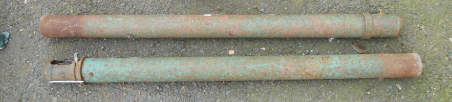 A pair of vintage green painted metal tennis net posts