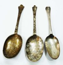 A pair of antique white metal trefid anointing spoons with various bowl and stem stamps featuring