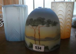 Three vintage opaque glass lamp shades including a landscape decorated example